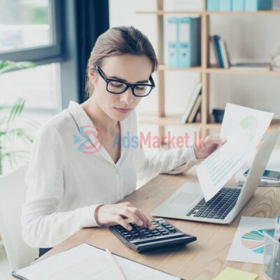 Financial-Woman-Uses-Calculator-With-Paper-Documents-In-Office